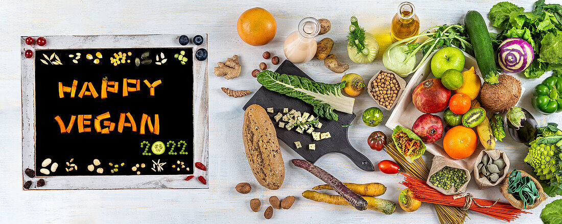 'Happy Vegan 2022' alongside organic fruit, organic vegetables and cereals