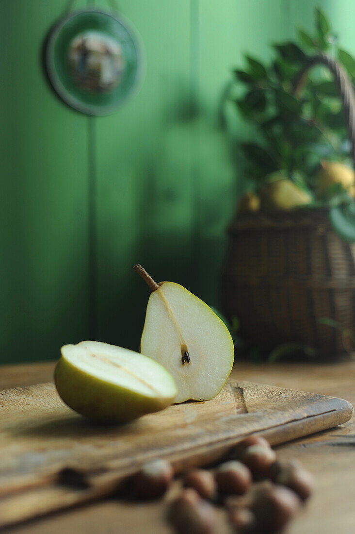 Halved pears on a wooden board