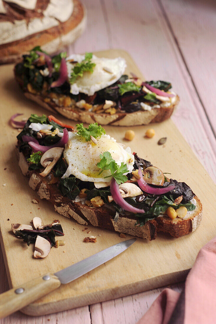 Toasted bread with chard, mushrooms, and poached egg