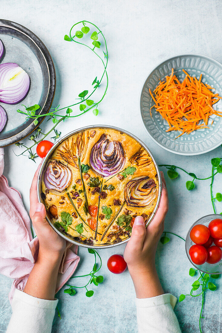 Focaccia with red onions, cherry tomatoes and grated carrots