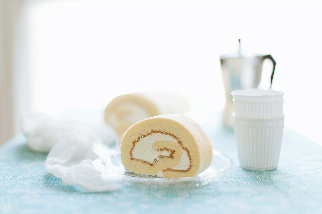 Vanilla sponge cake roulade with coffee