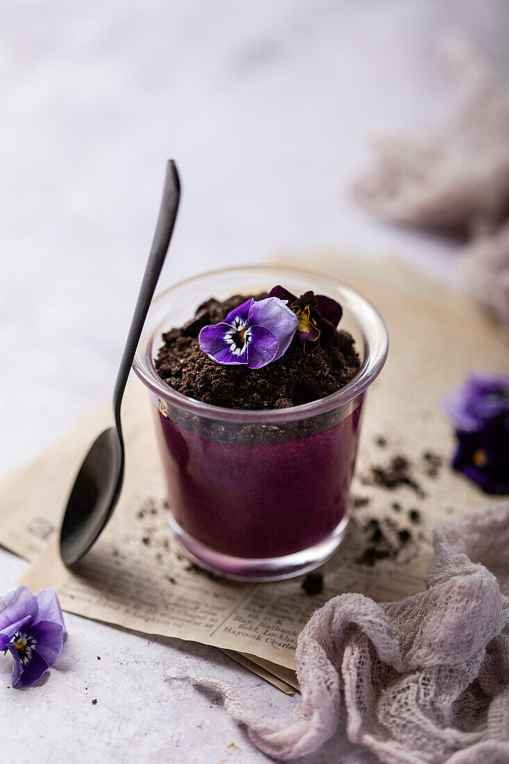 Panna cotta with blueberries and edible flowers