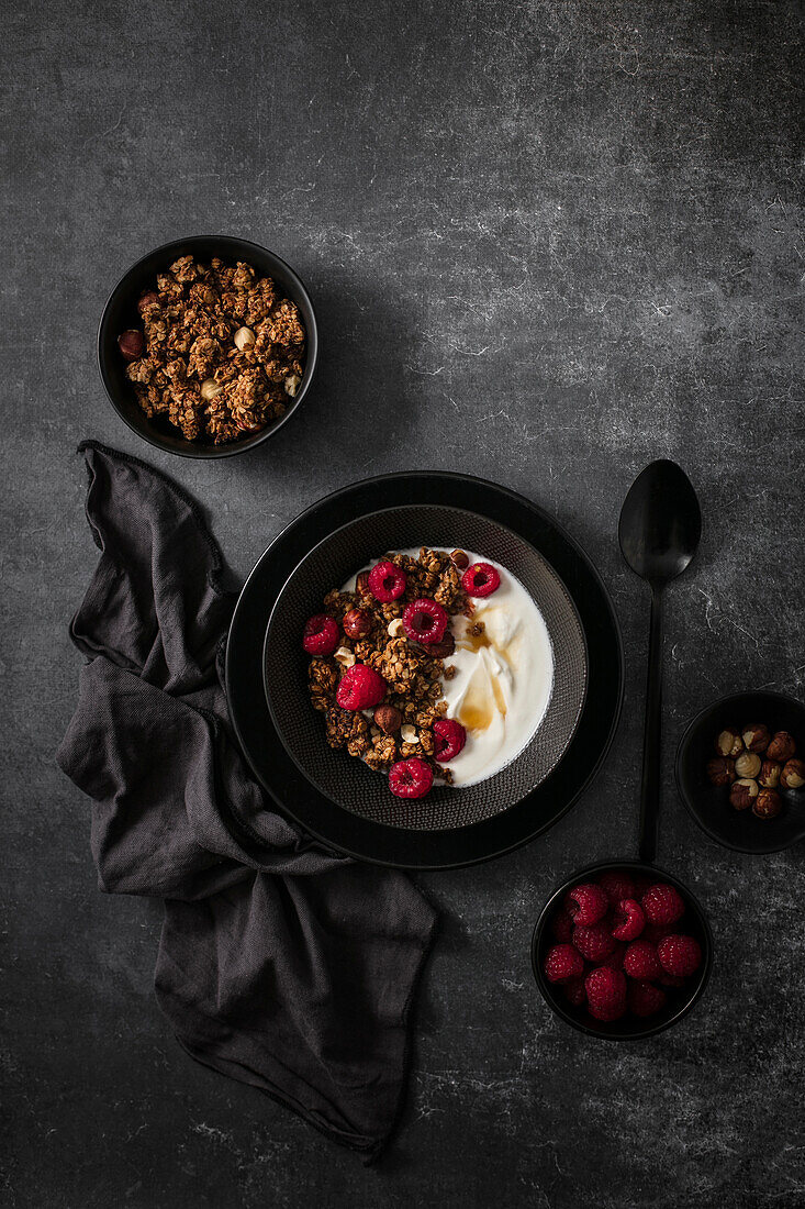 Breakfast with yoghurt,raspberries and granola