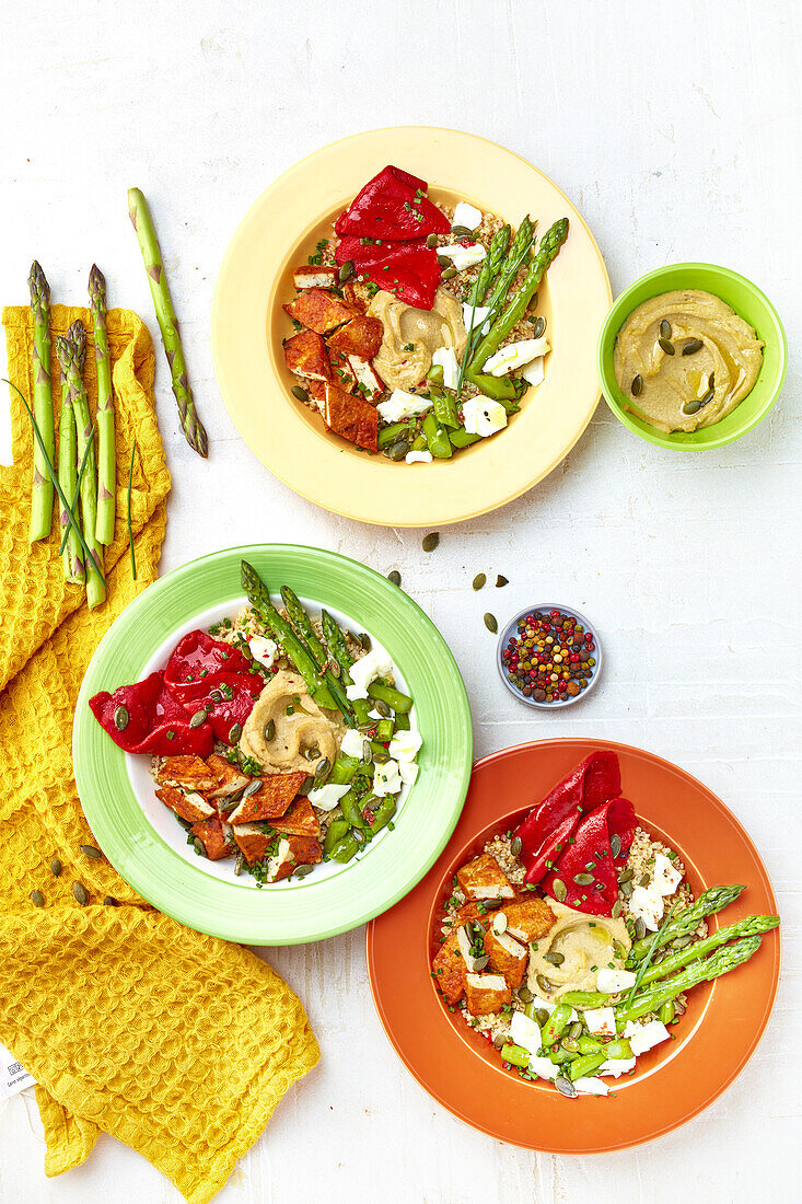 Hummus with green asparagus, red pepper, bulgur wheat and grilled tofu