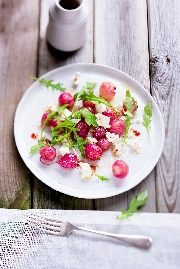 Radish salad with feta cheese and arugula