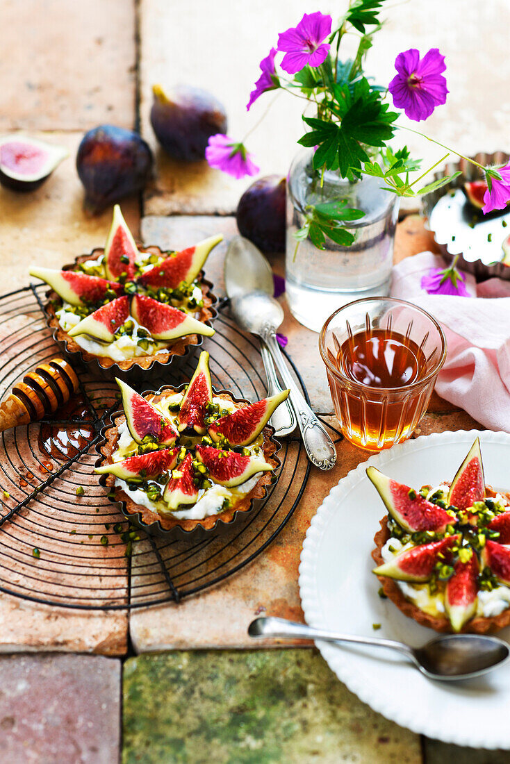 Fig, pistachio, and honey tartlets