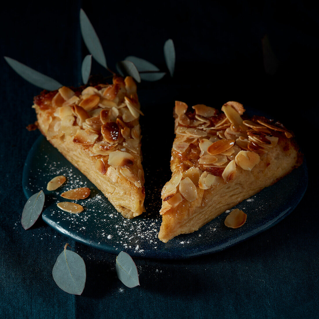 Gateau Invisible (French apple pie) with flaked almonds