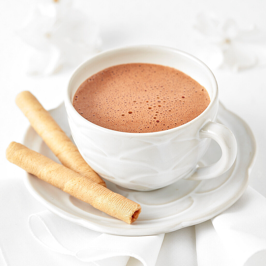 Hot chocolate served with pirouette cookie