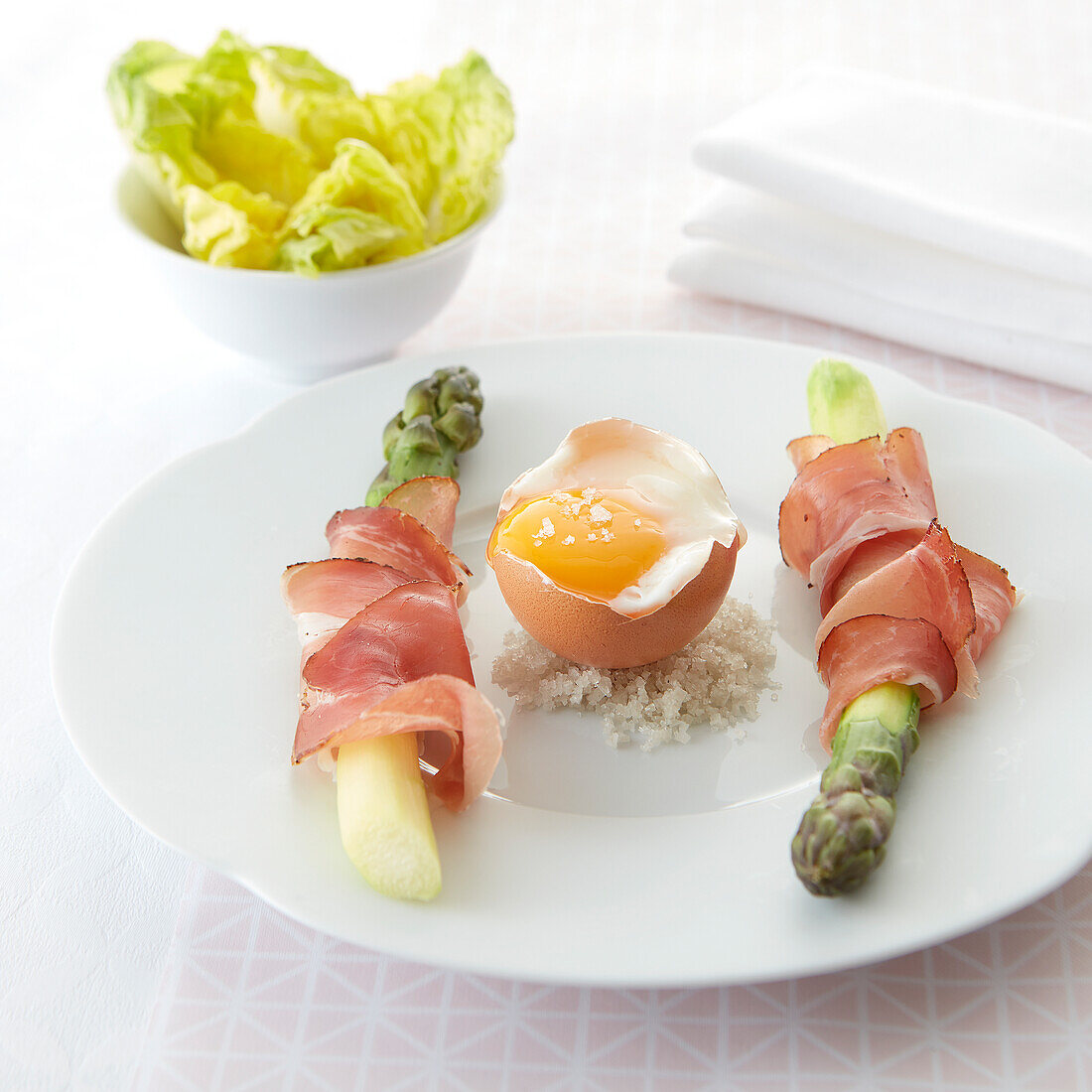 Egg parfait with green asparagus wrapped in ham