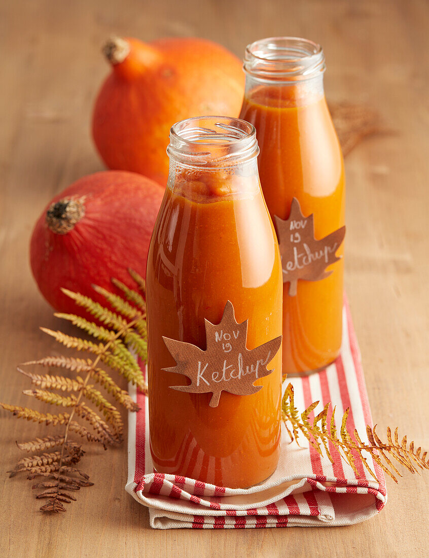 Homemade pumpkin ketchup in glass bottles