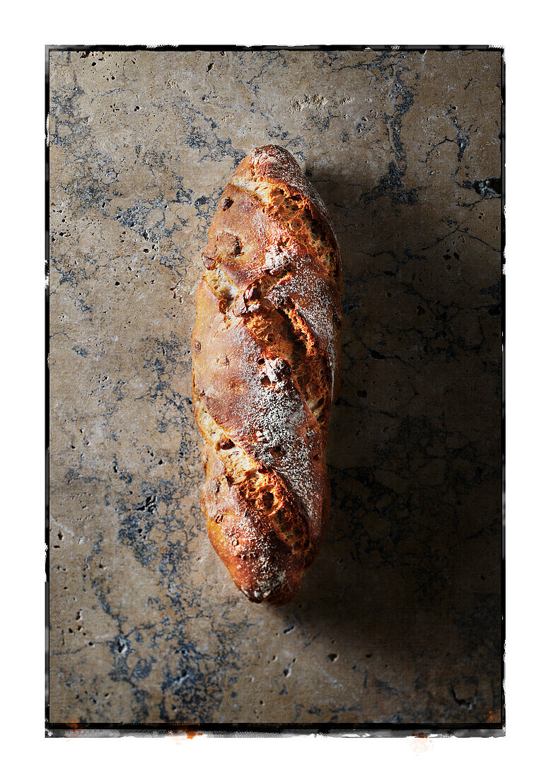 A walnut bread on a stone background