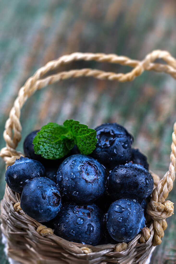 Blueberries in a small basket (Close Up)