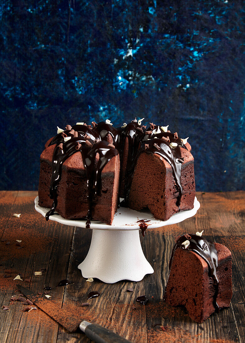 Chocolate bundt cake, cut on a cake stand