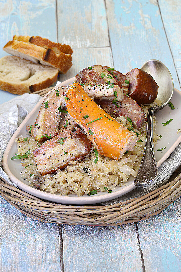 Choucroute with sauerkraut, bacon, pork and sausage