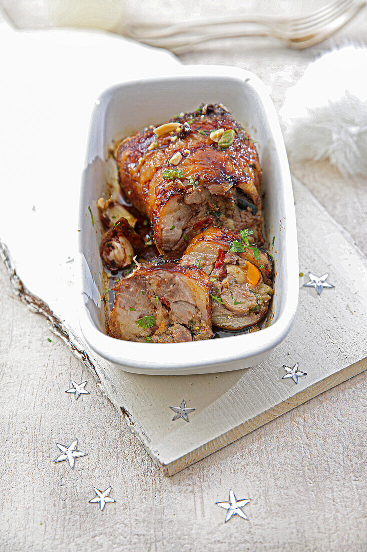Goose leg stuffed with dried fruits, apricots, sultanas, figs, Brazil nuts, and pistachios