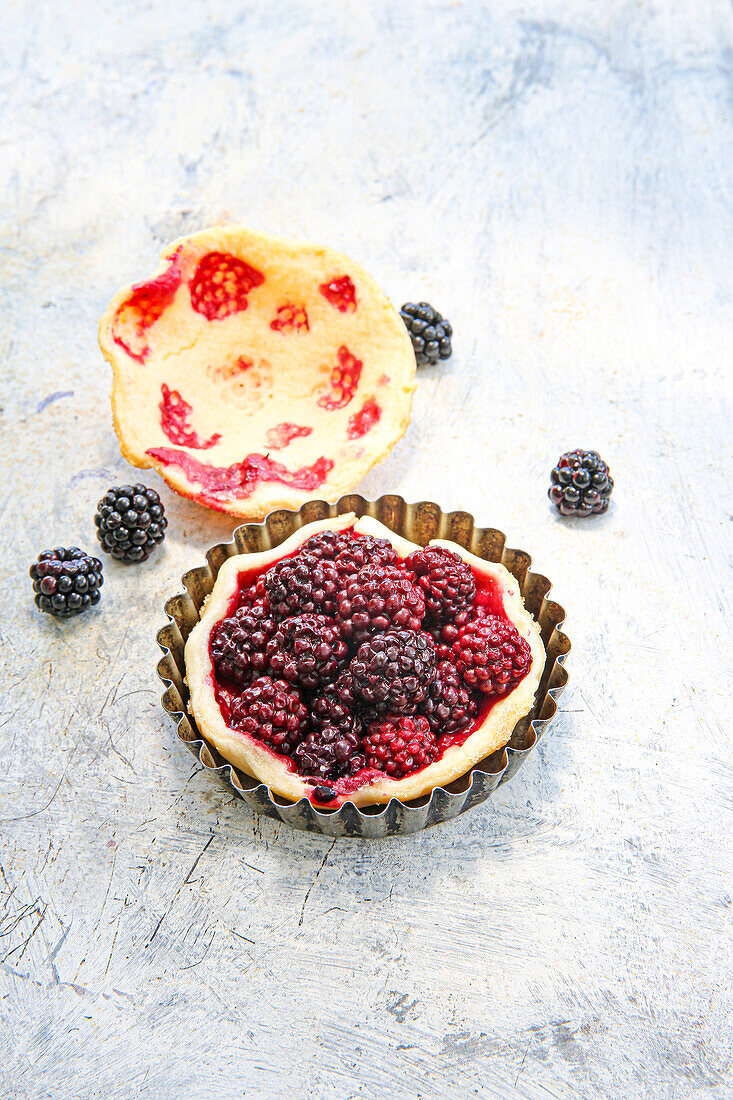 Small shortcrust pastry tarts with blackberries