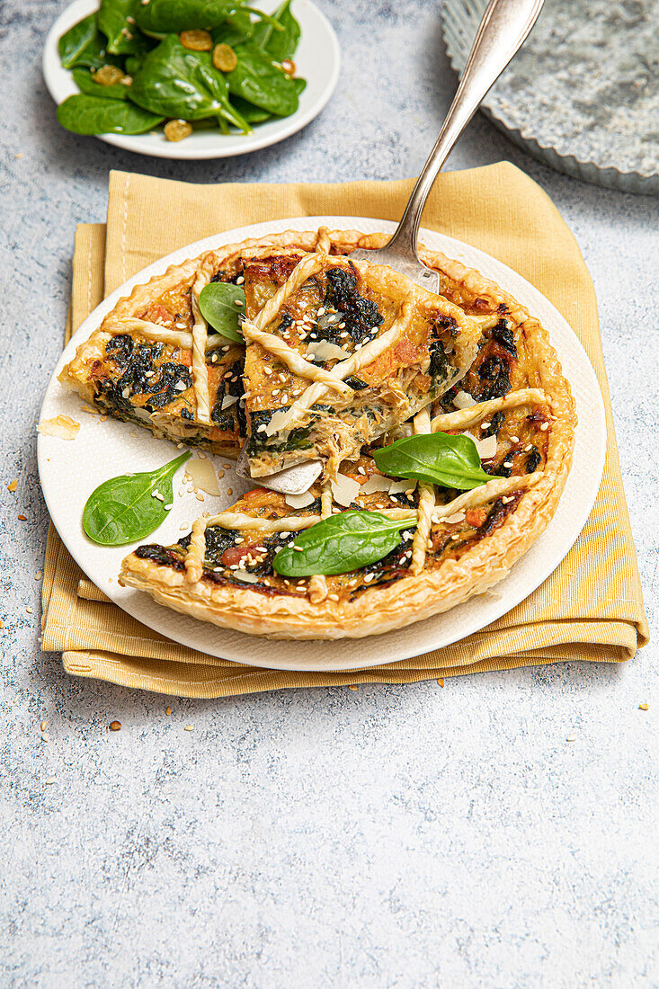 Puff pastry quiche with rabbit confit, carrots and spinach