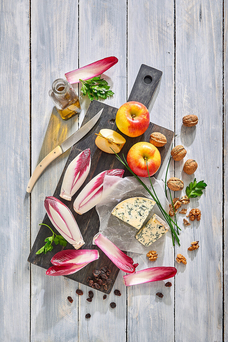 Ingredients for vitamin-rich salad with red chicory, Fourme d'Ambert, apple and walnuts