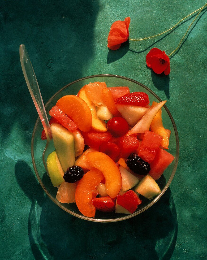 Fruit Salad in a Glass Bowl; Poppies
