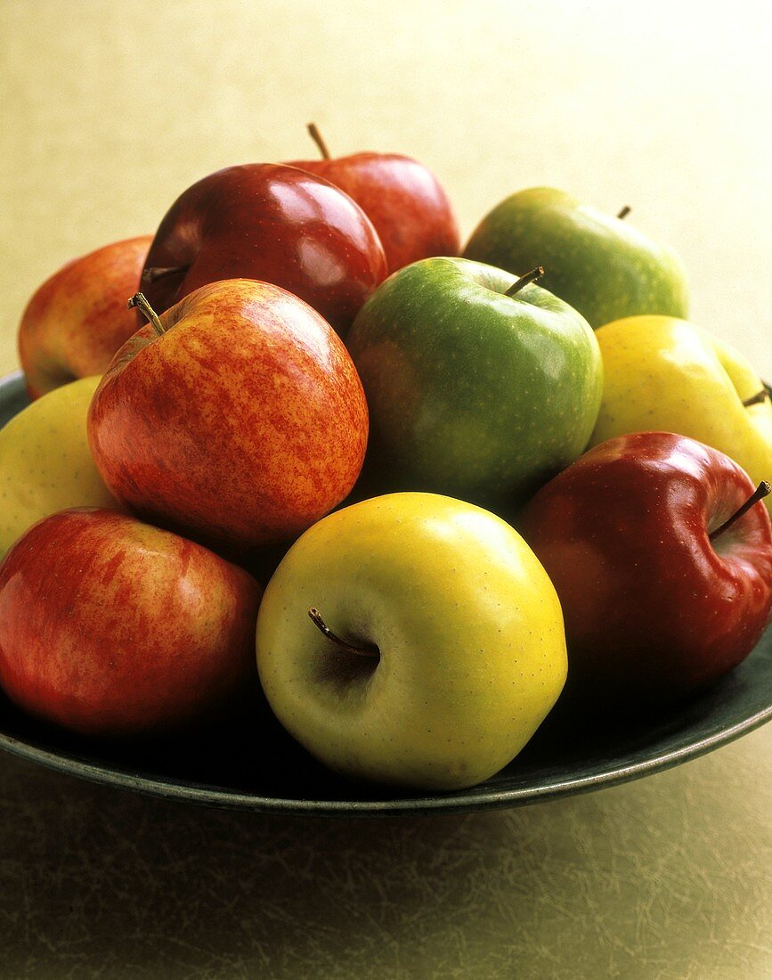 Assorted Types of Apples in a Bowl