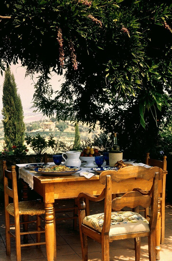 Table Setting Outdoors Overlooking Tuscany