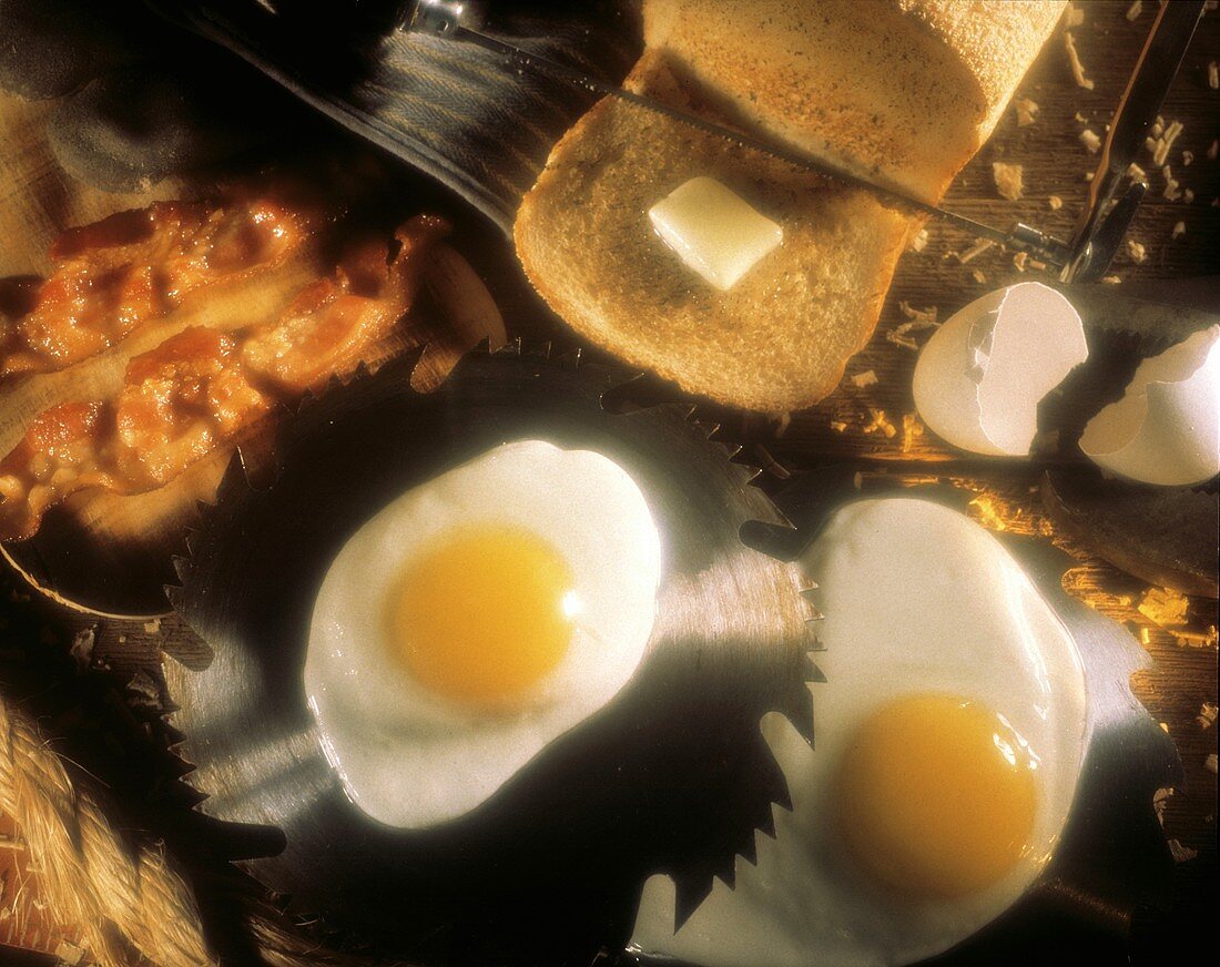 Fried Eggs on Saw Blade; Bacon and Toast