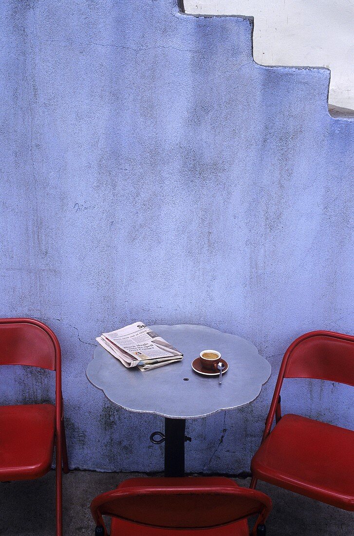 Table at Cafe with Espresso and Newspaper