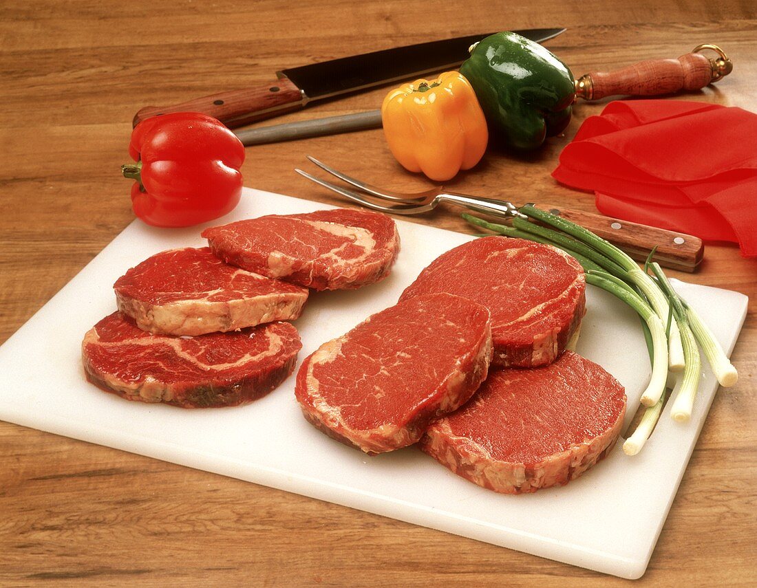 Raw Beef on Cutting Board with Vegetables