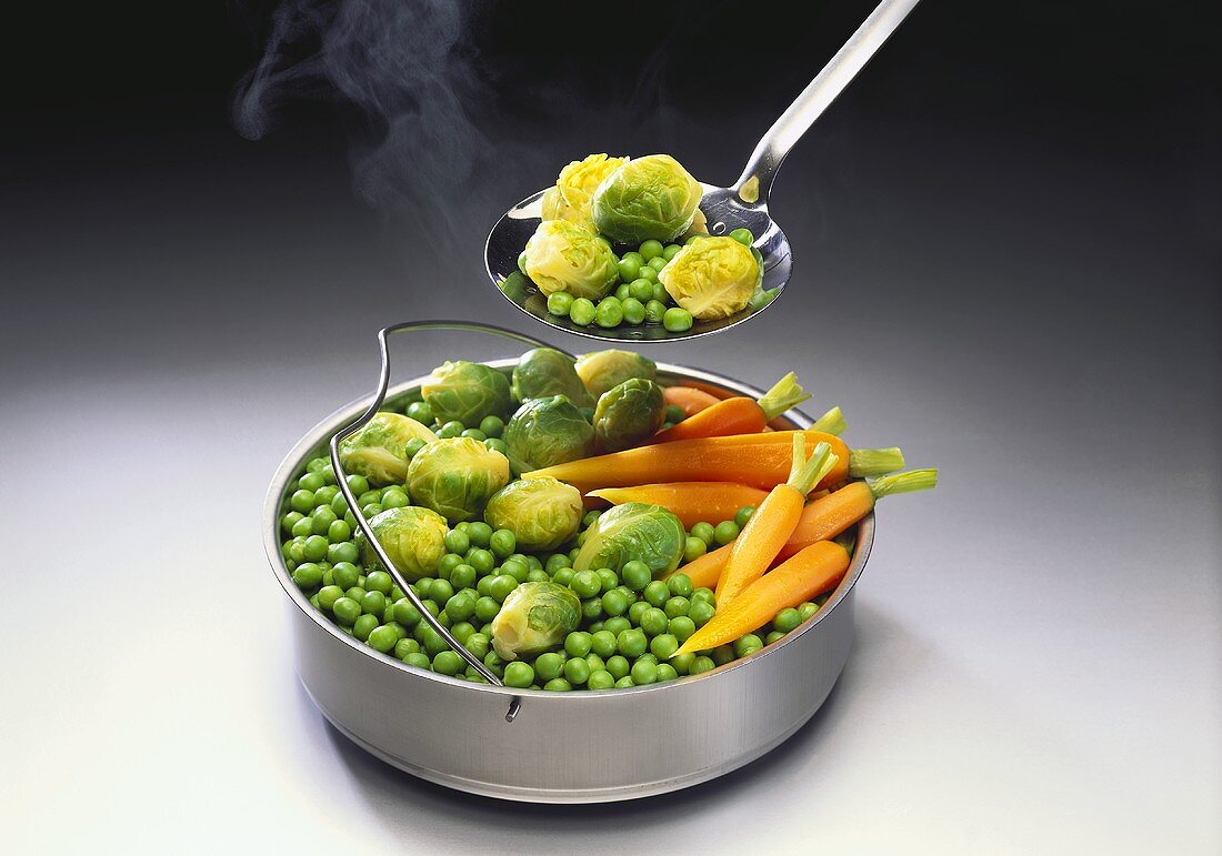 Steamer tray with steamed vegetables