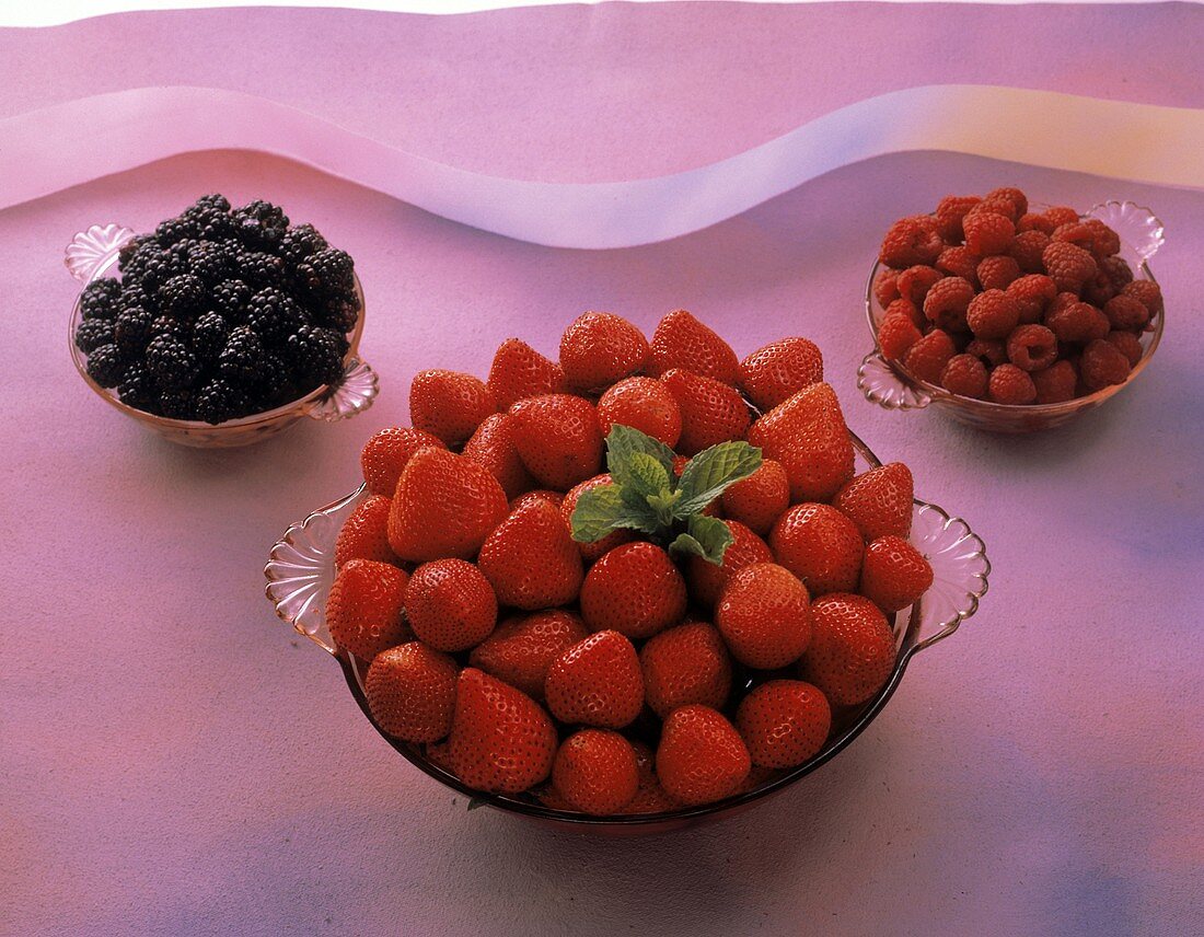 Assorted Berries in Glass Bowls; Strawberries; Raspberries; Blackberries