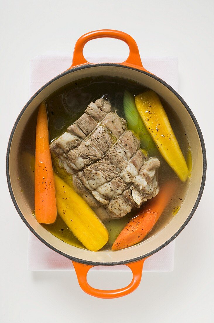 Boiled beef with soup vegetables in cocotte