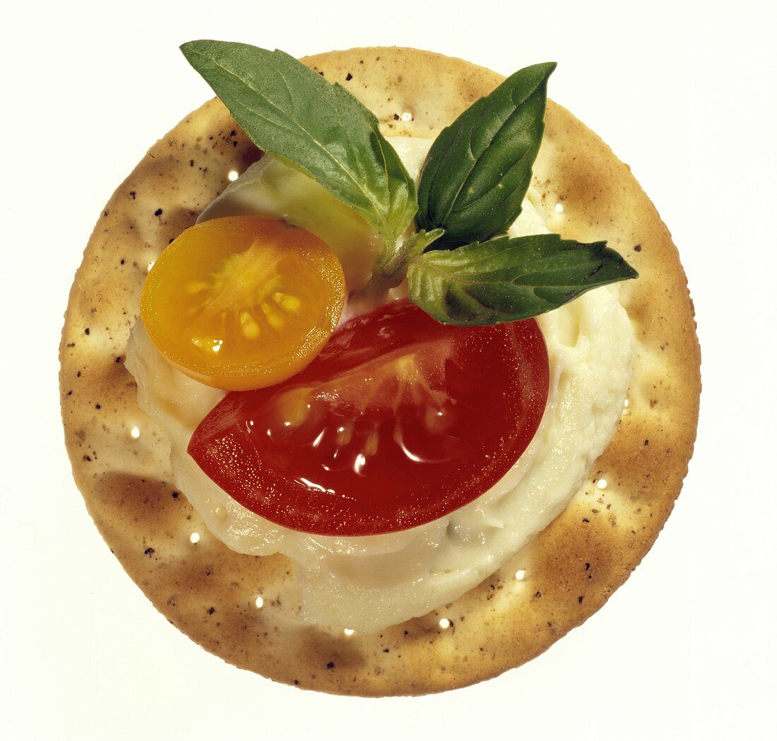 Cracker with Cheese Spread and Tomato