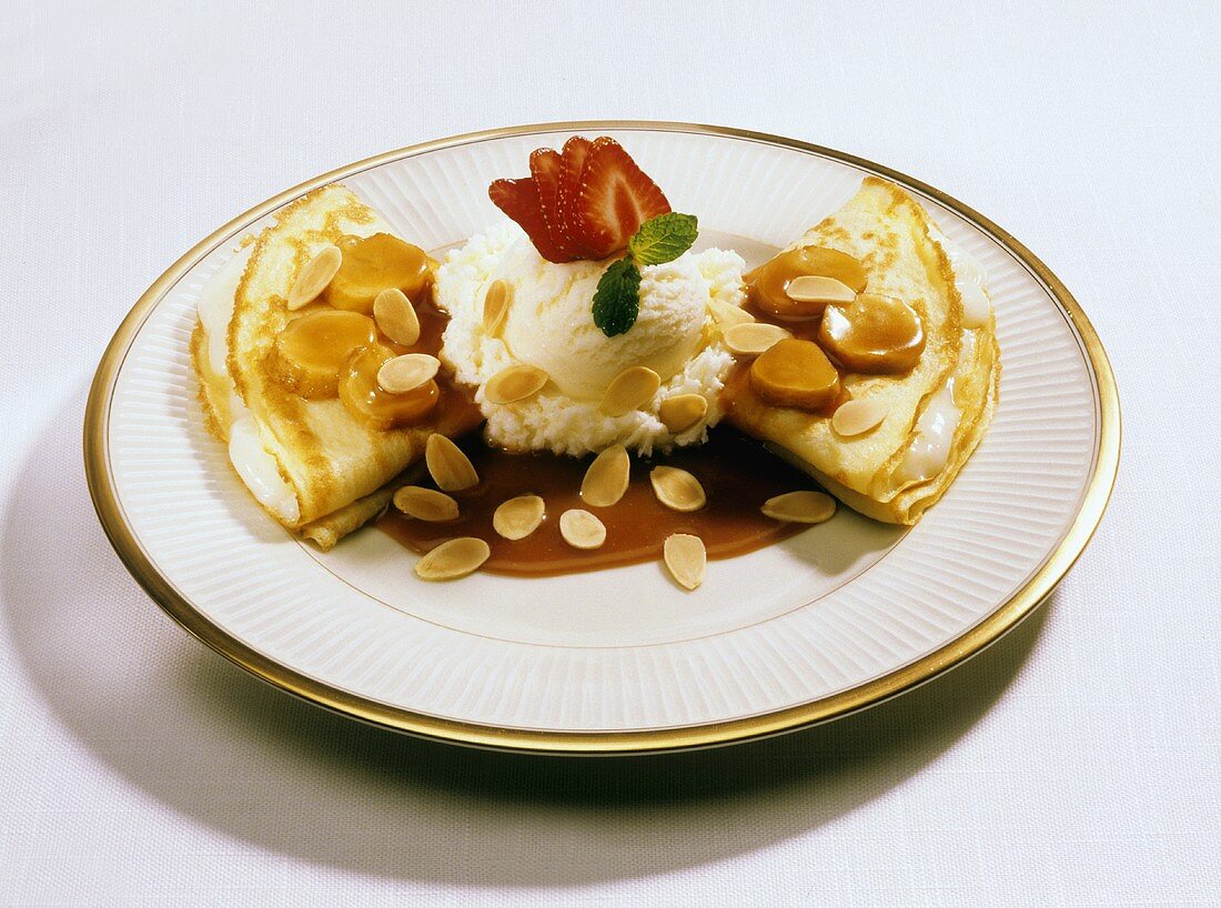 Cream-filled crepes with ice cream and caramel sauce