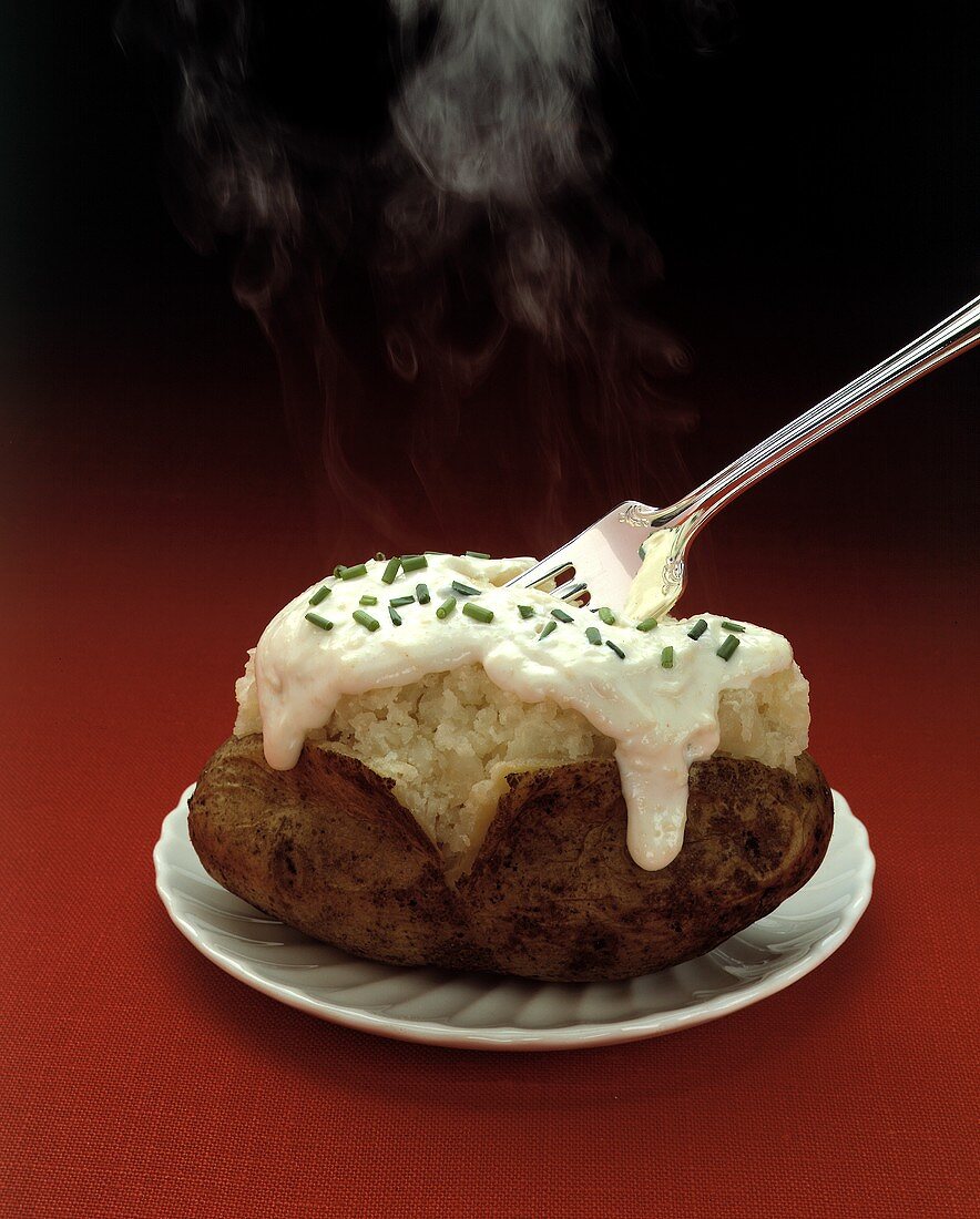 Steaming Baked Potato with Sour Cream