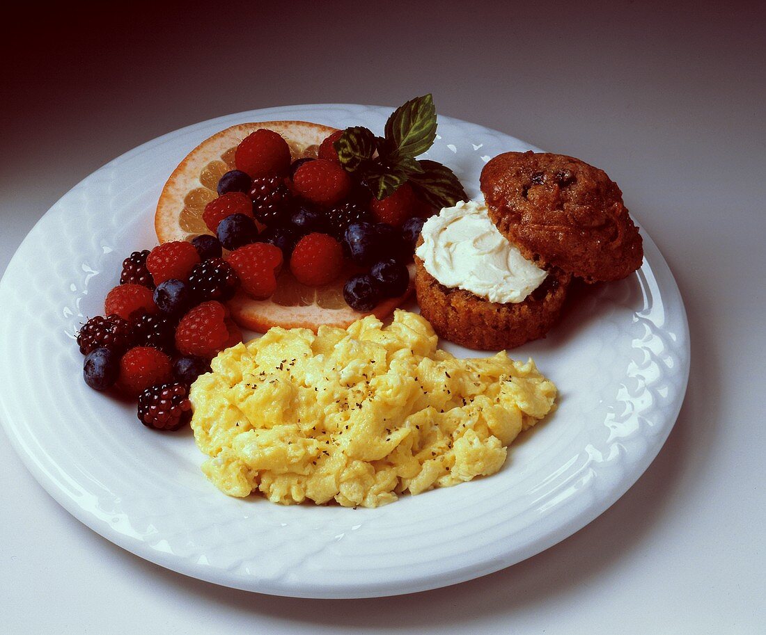 Scrambled Eggs with a Raisin Muffin and Fresh Fruit