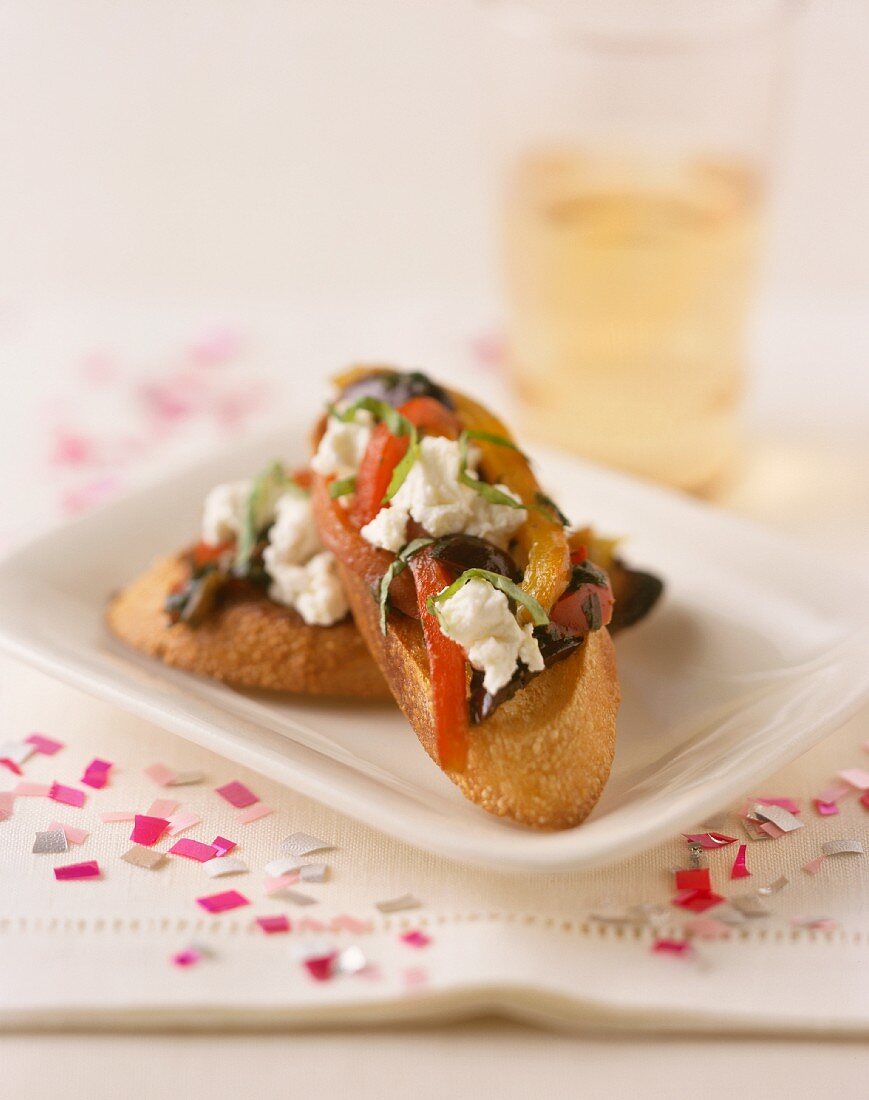 Crostini (Goat's cheese, peppers & olives on toasted bread)