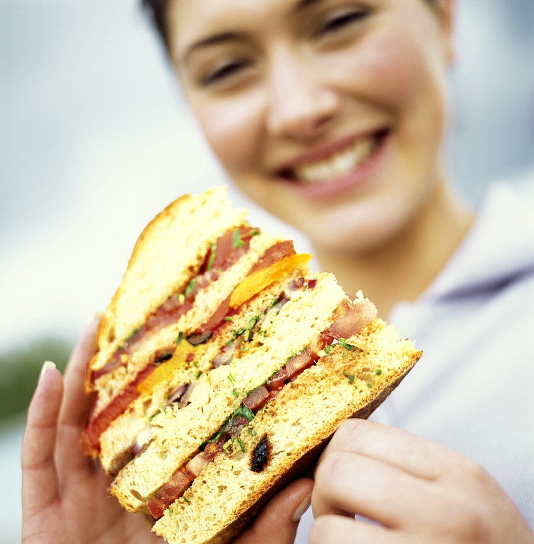 Holding a Sandwich