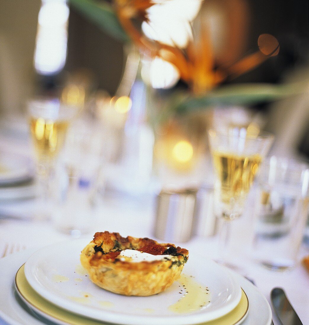 Table Setting with Spinach and Puff Pastry Appetizer