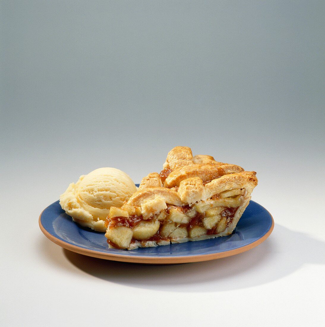 Slice of Apple Pie with Scoop of Vanilla Ice Cream