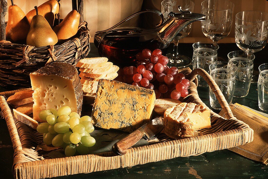 Cheese Assortment on Wicker Tray with Bread and Fruit
