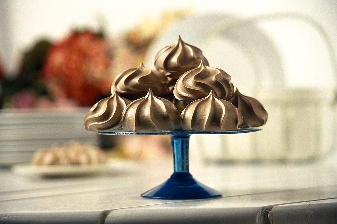 Chocolate Meringues on a Blue Glass Stem Plate
