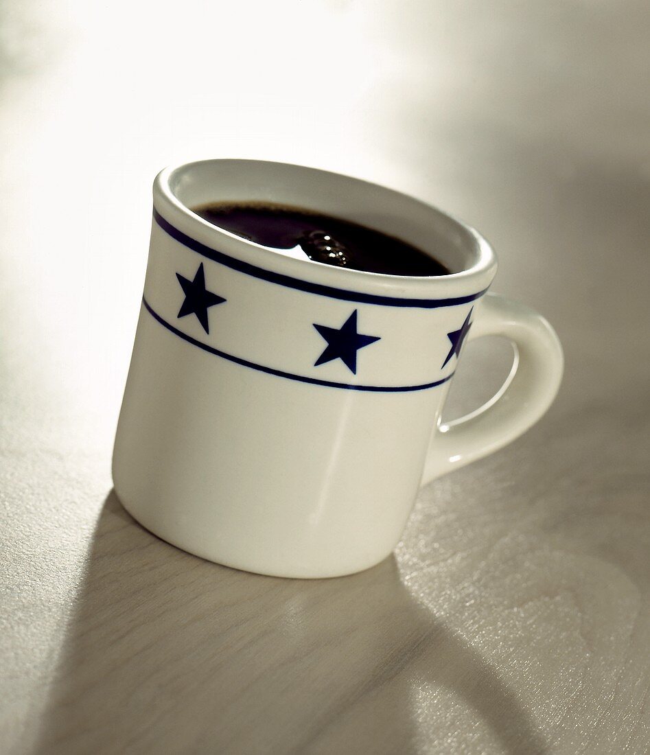 Black Coffee in a Mug with Stars