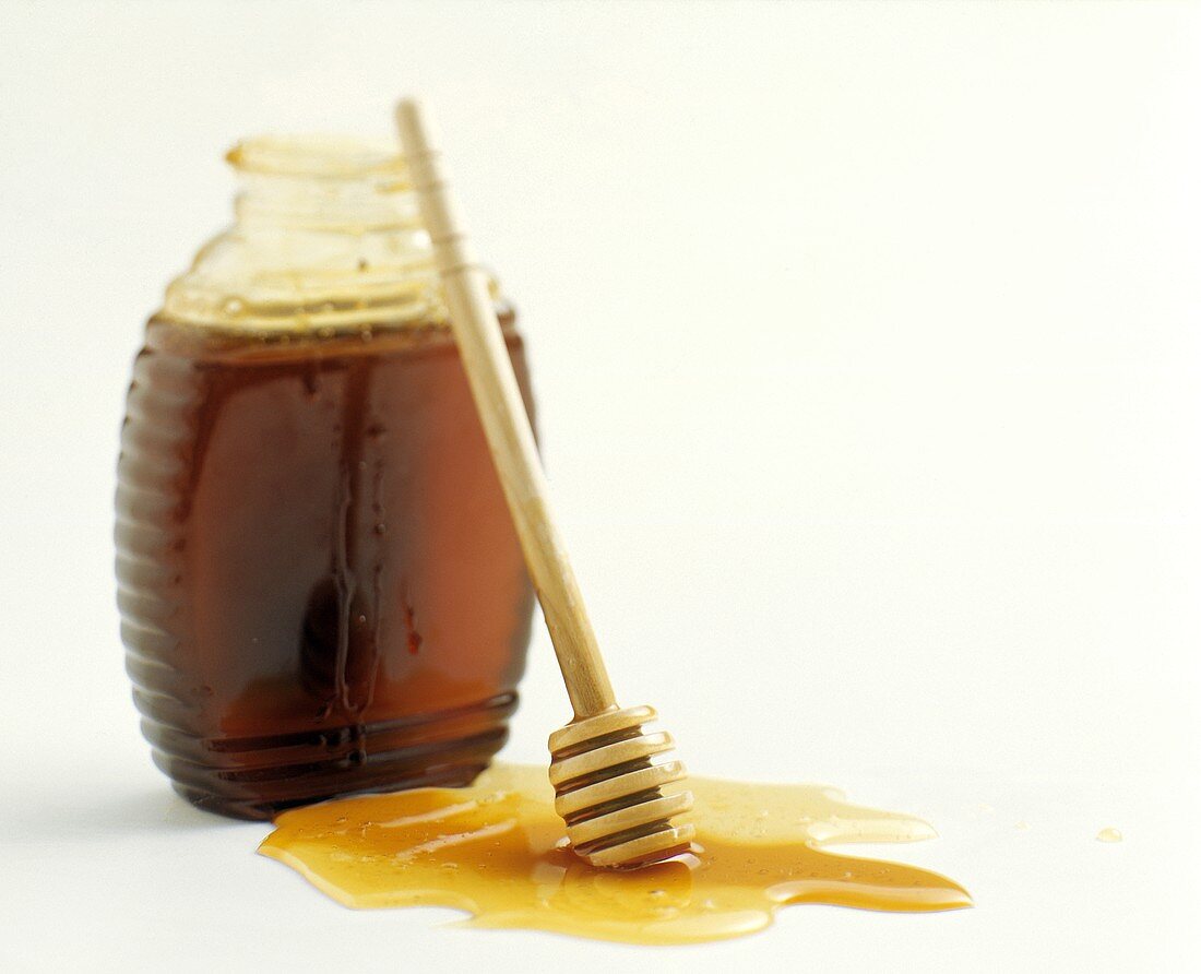 Honigflasche und Honigkamm