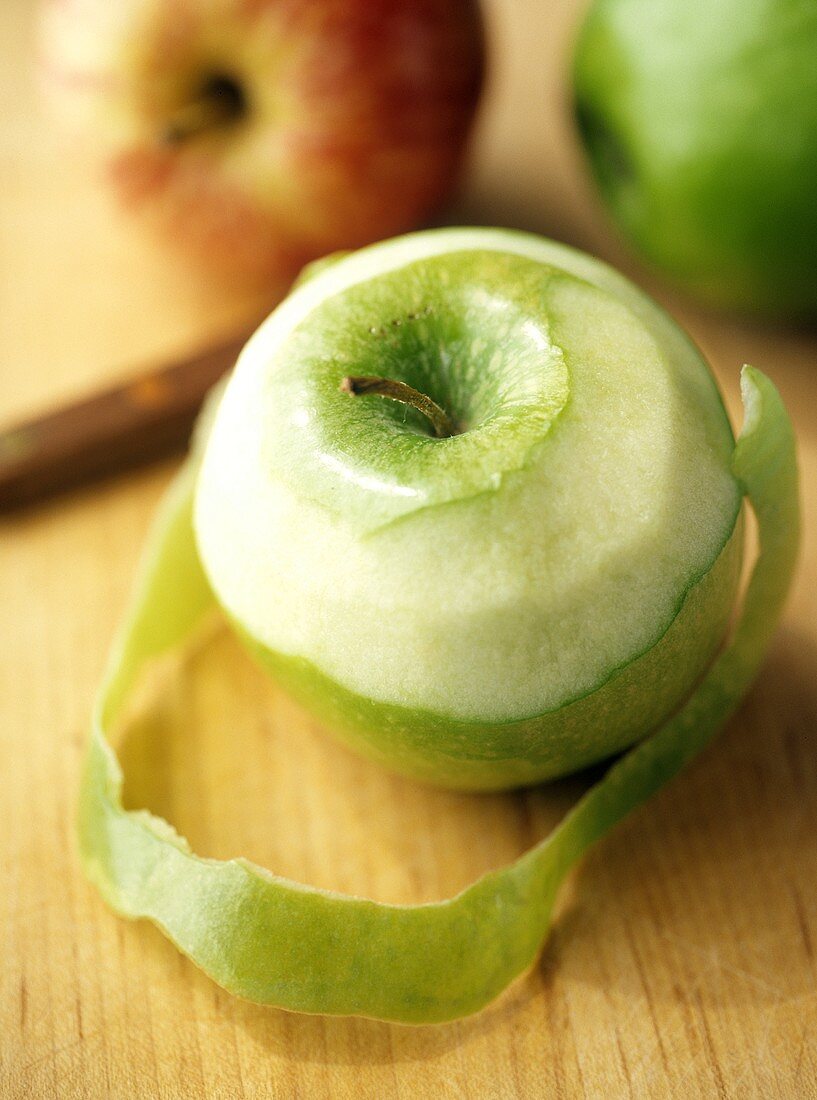 A Partially Peeled Granny Smith Apple