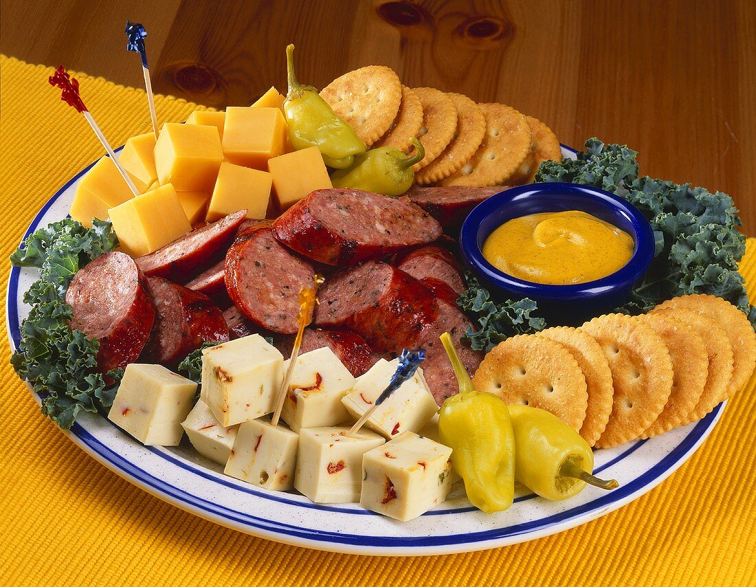 An Hors d'oeuvre Platter with a Selection of Meats, Cheeses and Crackers