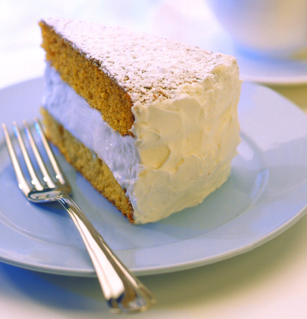 A SLice of Spice Cake with White Cream Frosting