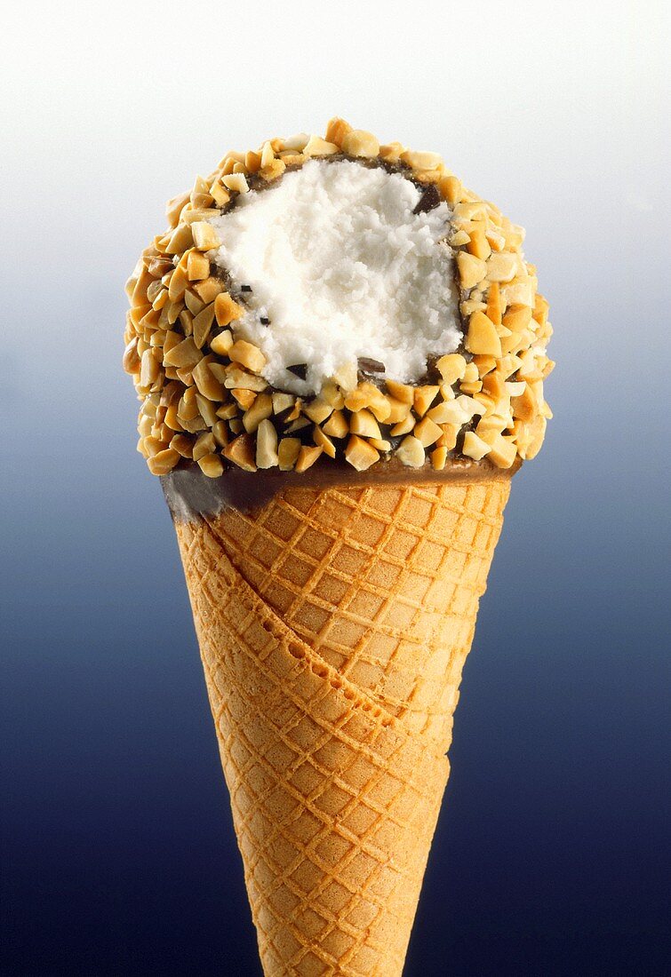 A Chocolate Covered Vanilla Ice Cream Cone with Nuts