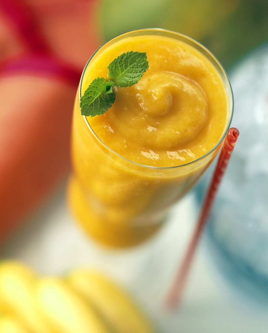 Mango Smoothie in a Tall Glass with Mint