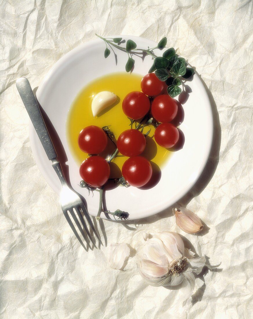 Cherry Tomatoes on a Plate with Garlic and Herbs