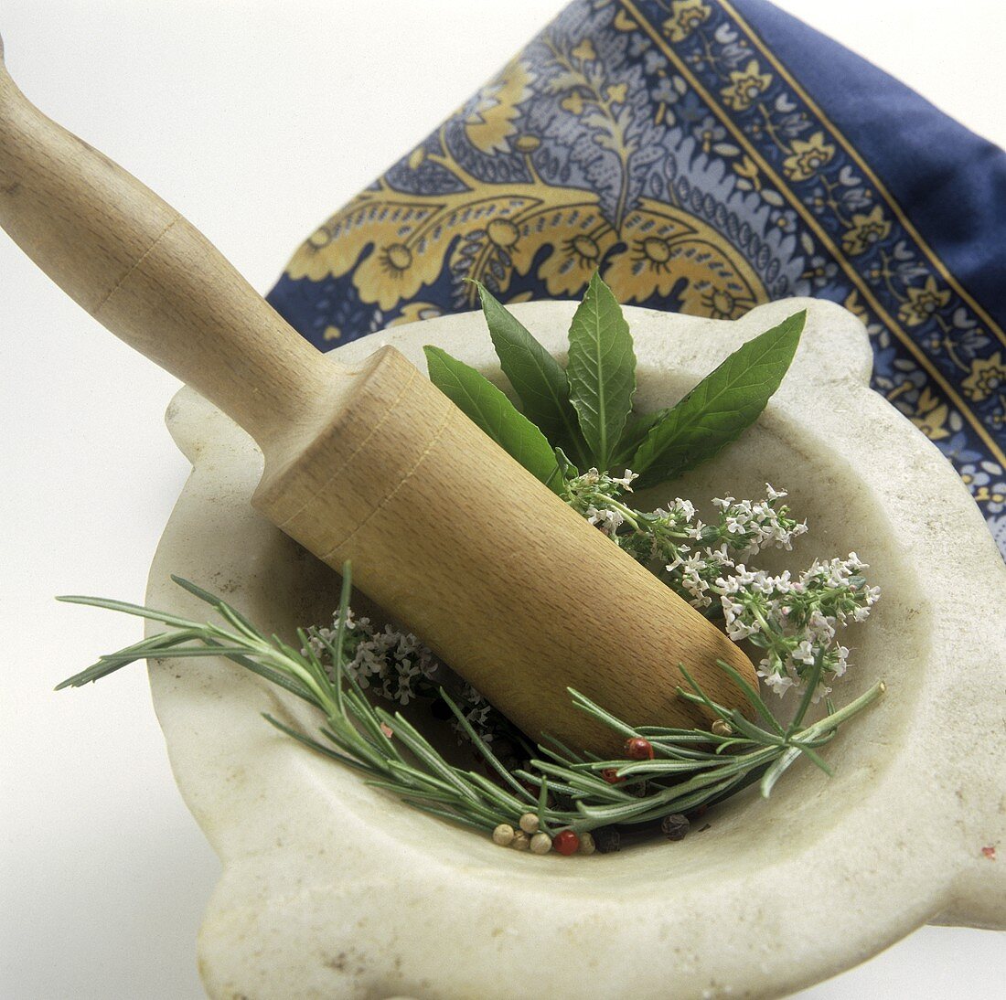 A Mortar and Pestle with Fresh Herbs